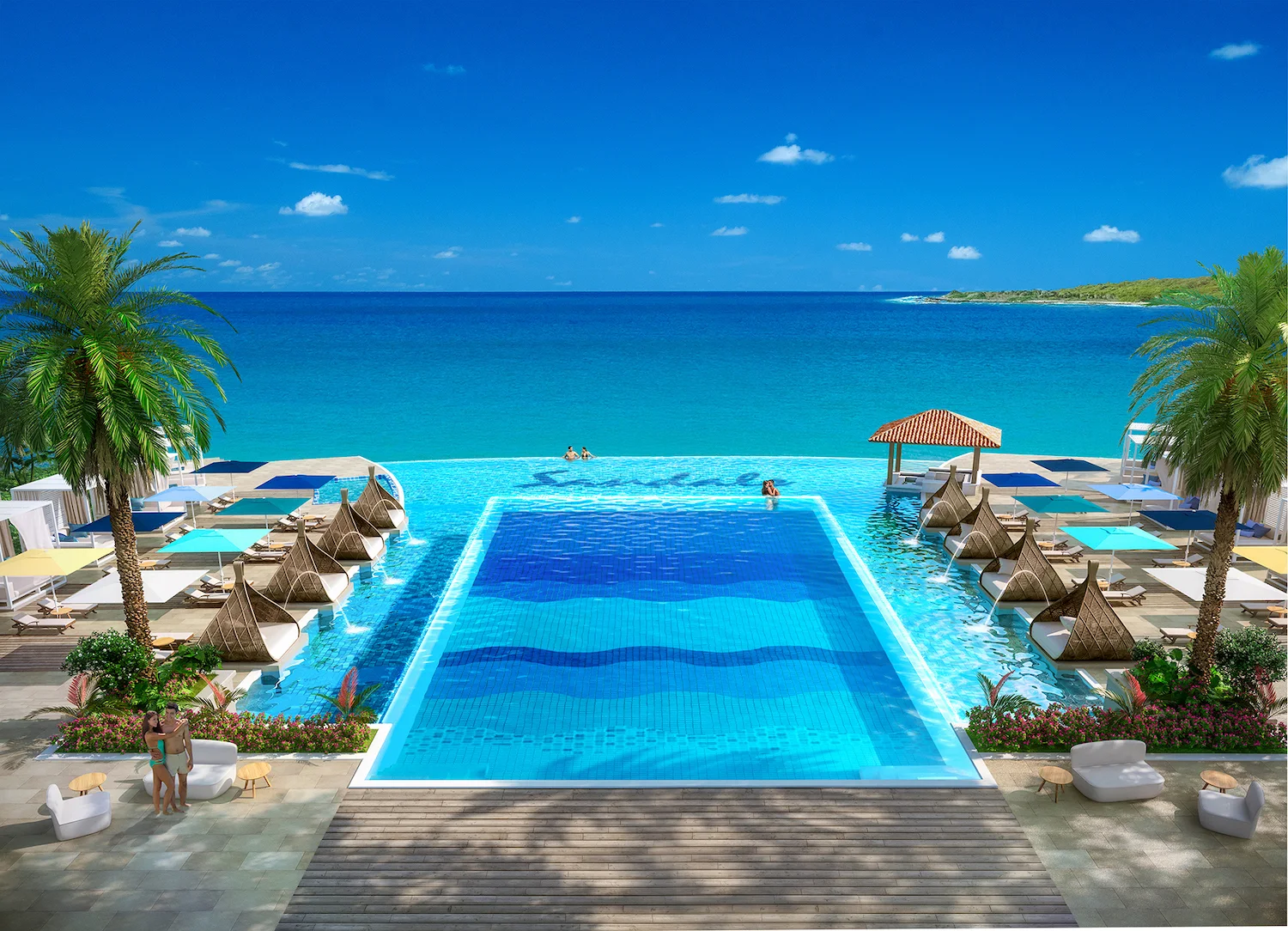 Pool mit Blick auf Meer und Palmen auf Curaçao